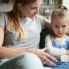 Angry offended little girl ignoring mother words
